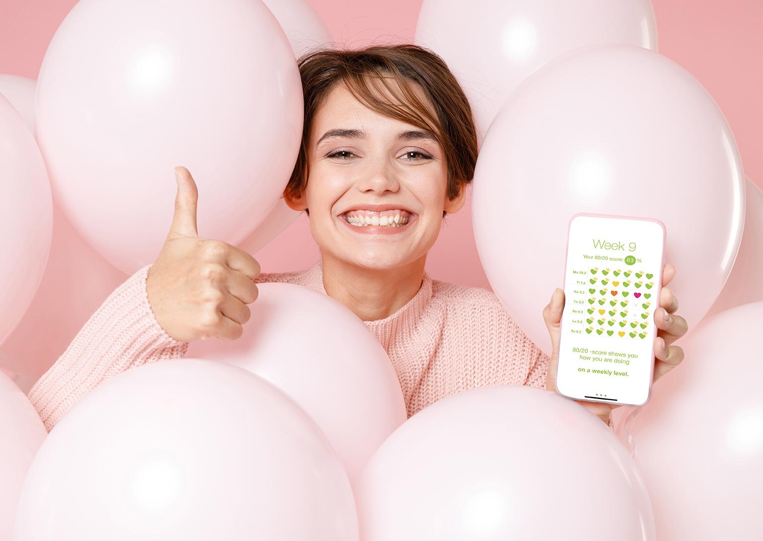 Happy woman using 80/20 Coach app